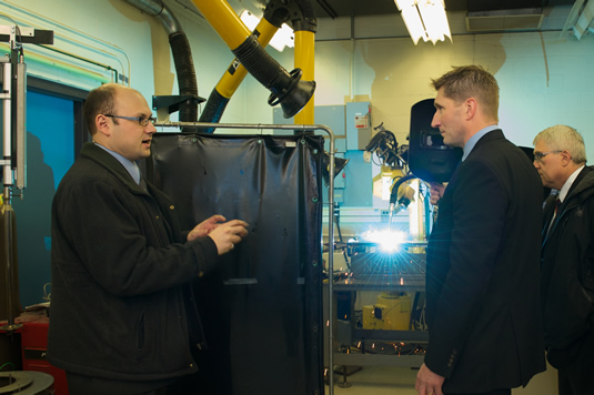 Adrian Gerlich demonstrates a welding apparatus.