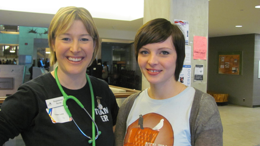 Mia Bernier (right) talks to alumna Colleen Loree.