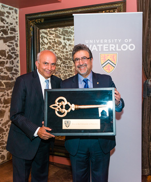 Prem Watsa and Feridun Hamdullahpur with a ceremonial key.