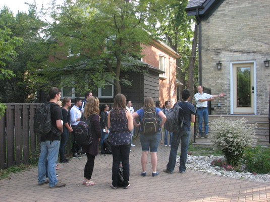 A group of people outside a REEP house.