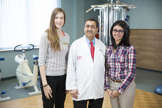 Subhash Dighe with his current co-op students at West-End Physio Clinic.