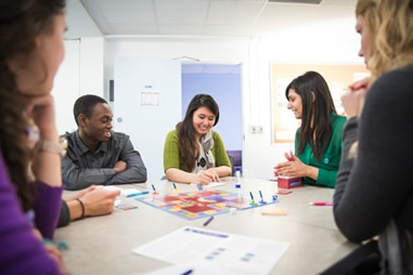 Students enjoy a board game.