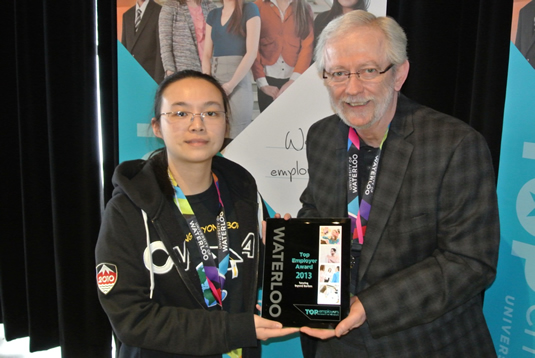 Brenda Lee of Tutoring Beyond Borders receiving a 2013 Top Employer award from CECA account manager Colin Ross.