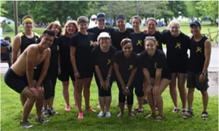 Smaller group photo of dragon boat team members.