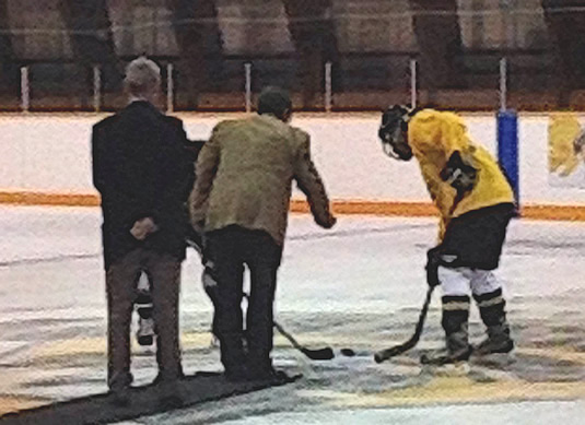 Feridun Hamdullahpur drops the puck at the Engineering hockey game.