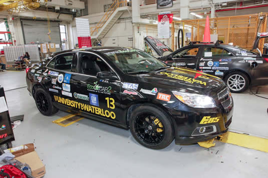 The UW Alternative Fuels Team's automobile in the workshop.