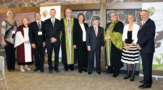 St. Paul’s board member Brenda Laronde Simpson, Religious Studies chair Mavis Fenn, United Church representative Ted Smith, AVP International Nello Angerilli, principal Graham Brown, Six Nations Polytechnic president Rebecca Jamieson, Victoria University.