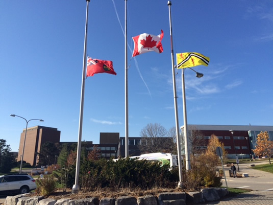 The flags at the University's south campus are at half-mast for Remembrance Day.