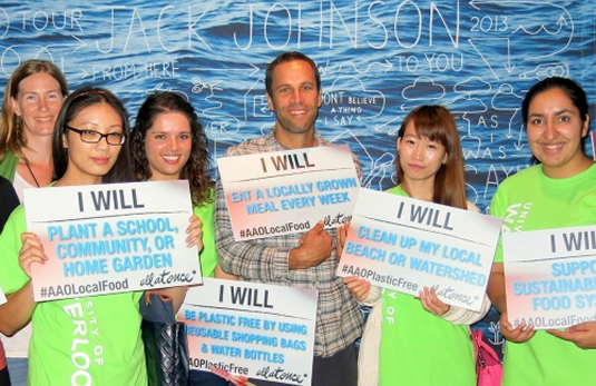 Students pose with musician Jack Johnson.