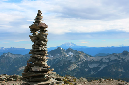 An Inukshuk on a mountainside.