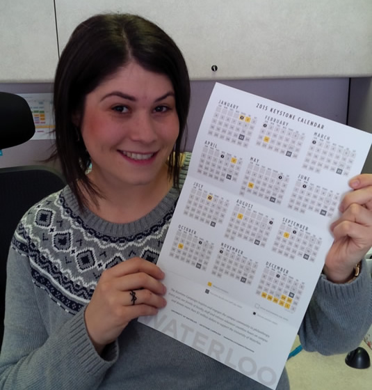 A woman poses with the Keystone Calendar.