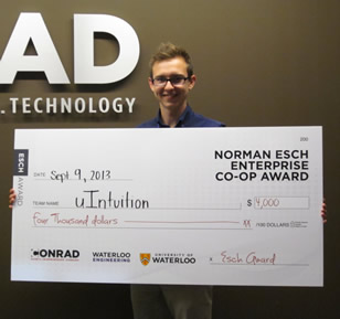 Michael Ulman of uIntuition poses with his oversized cheque.