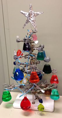 A Christmas tree made out of lab glassware.