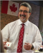 President Feridun Hamdullahpur holds a Treat-A-Gram box.